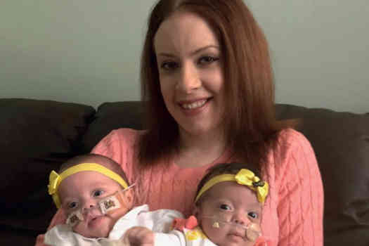  Ella-Mae (mum) holds twins Bella (left) and Ruby (right)